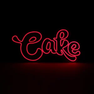 Glowing red LED neon sign with the word "Cake" in a stylish cursive script, perfect for bakery storefronts, dessert shops, and cafe wall decor.