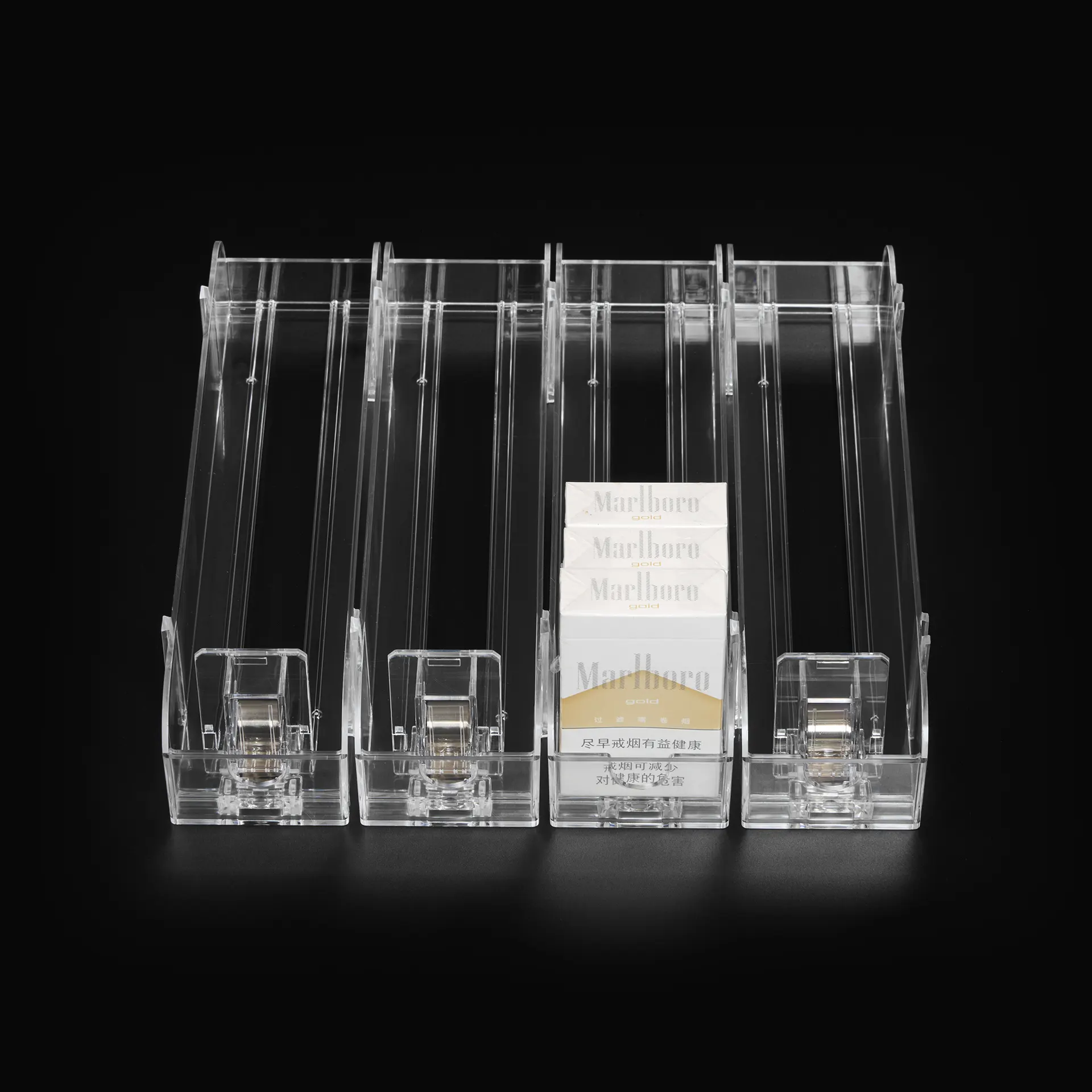 Transparent cigarette pushers shown with cigarette packs
