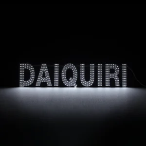 Sleek white LED dot-matrix business sign for daiquiri shops and cocktail bars, featuring the word "DAIQUIRI" in bright individual glowing bulbs. Slim 30x7 inch horizontal storefront window display with acrylic construction.