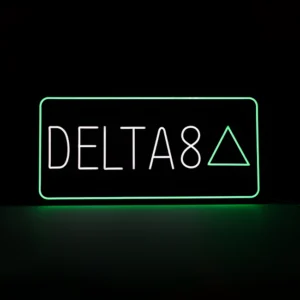 Green and white Delta 8 neon LED sign for smoke shops and dispensaries, featuring the words "DELTA 8" and a triangle symbol in a rectangular glowing frame. 35x17 inch storefront display.
