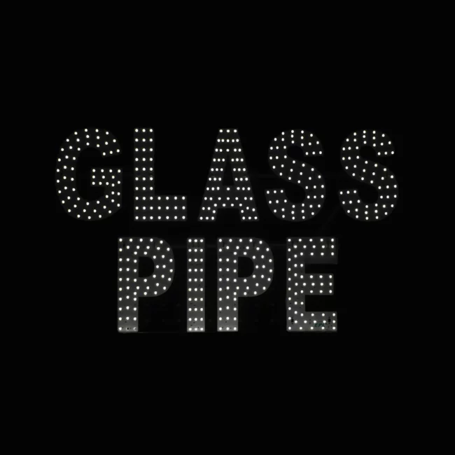 LED glass pipe shop sign with bright white lights on black background for business storefront display.
