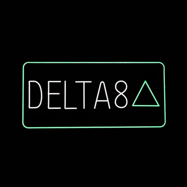 LED neon Delta 8 sign with white text and green triangle border for smoke shop display.