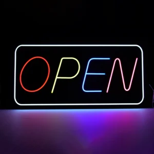 Vibrant multicolor neon LED "OPEN" sign for business storefronts, featuring a glowing white rectangular border and letters in red, yellow, blue, and pink against a dark background.