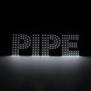 The word "PIPE" spelled out in individual bright white LED bulbs using a dot-matrix pattern. High-contrast glowing text display for smoke shop storefronts and retail signage.