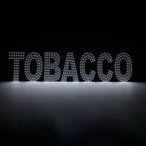 Bright white LED dot-matrix business sign for tobacco shops, featuring the word "TOBACCO" in individual glowing bulbs. 38x9 inch horizontal horizontal display with flashing and steady lighting modes for storefront windows.
