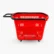 A side profile of a red plastic shopping basket featuring four wheels and a long black pull handle extended horizontally for easy towing.